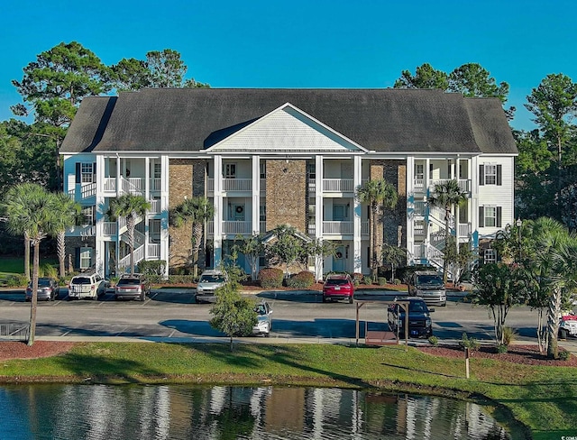 view of building exterior featuring a water view