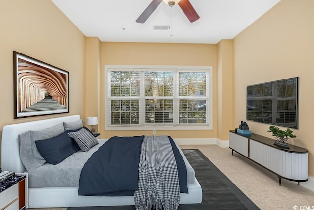 bedroom featuring carpet, ceiling fan, and baseboards