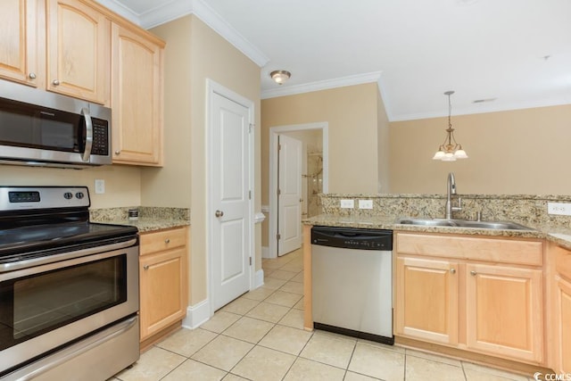 kitchen featuring appliances with stainless steel finishes, light brown cabinets, a sink, crown molding, and light tile patterned floors