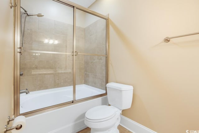 full bath with toilet, combined bath / shower with glass door, and baseboards