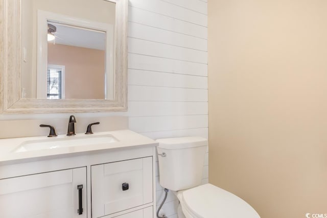bathroom featuring toilet and vanity