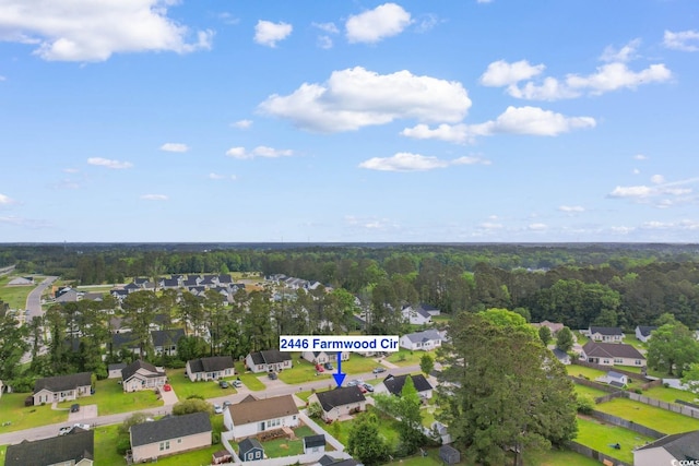 birds eye view of property with a residential view and a forest view