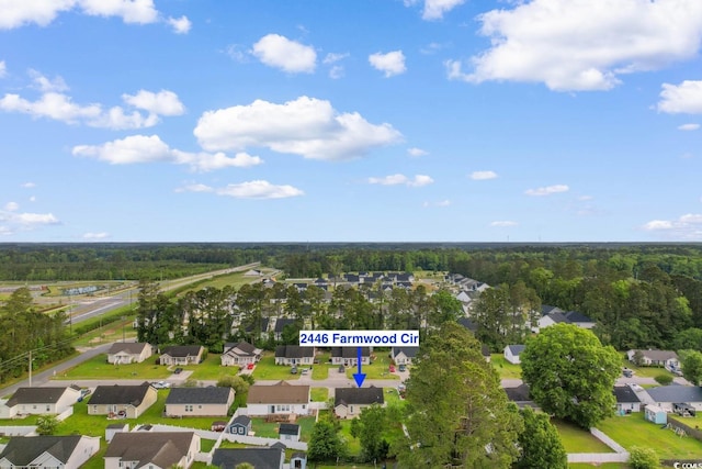 bird's eye view with a residential view and a wooded view