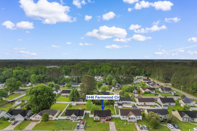 bird's eye view featuring a residential view and a forest view