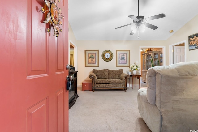 living room with light colored carpet and ceiling fan