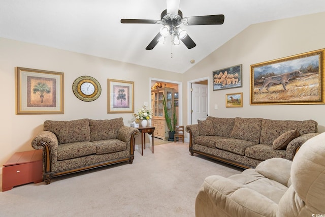 living area with ceiling fan, light carpet, and lofted ceiling