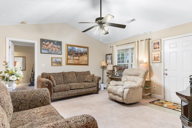 living area featuring carpet flooring, a ceiling fan, visible vents, and lofted ceiling