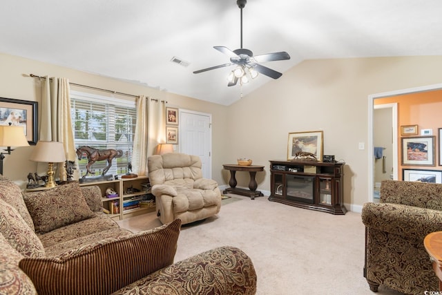 living room featuring carpet, a ceiling fan, baseboards, vaulted ceiling, and visible vents