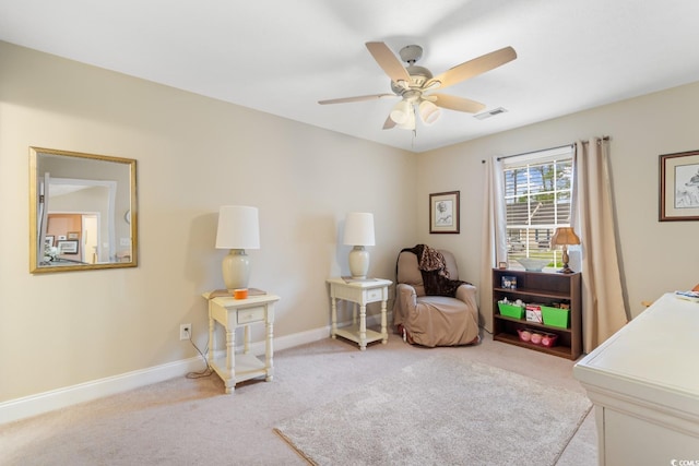 living area featuring carpet flooring, a ceiling fan, baseboards, and visible vents