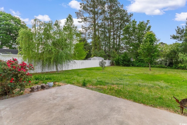view of yard featuring a patio and fence