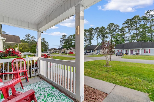 view of patio / terrace featuring a residential view and a porch