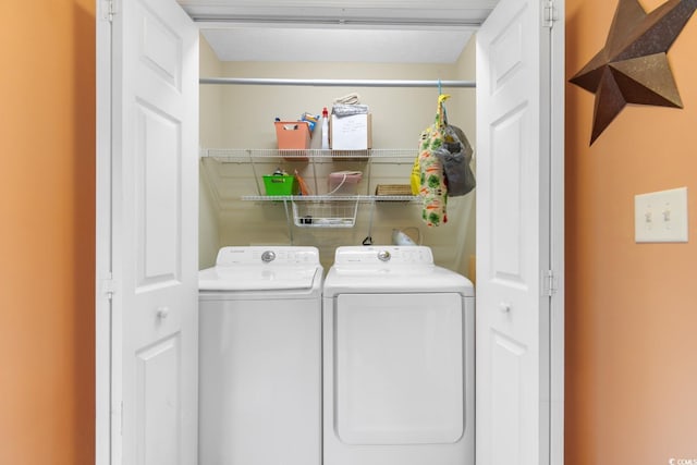 washroom with separate washer and dryer and laundry area