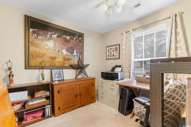 office with light colored carpet, a ceiling fan, and visible vents