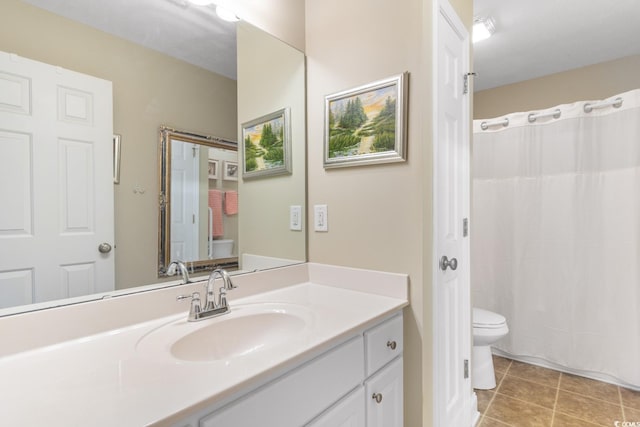 bathroom with tile patterned floors, vanity, toilet, and a shower with shower curtain