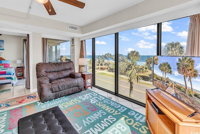 5511 N Ocean Blvd Unit 209, Myrtle Beach, SC 29577 - living area with light tile patterned floors and a ceiling fan