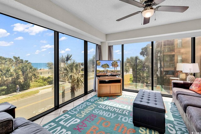 5511 N Ocean Blvd Unit 209, Myrtle Beach, SC 29577 - tiled living room featuring ceiling fan and a textured ceiling