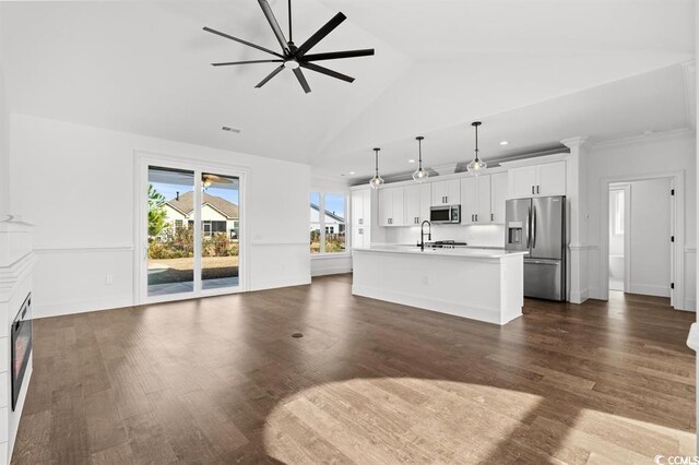 163 Sago Palm Dr, Myrtle Beach, SC 29579 - unfurnished living room with a sink, a ceiling fan, a glass covered fireplace, dark wood-style flooring, and recessed lighting