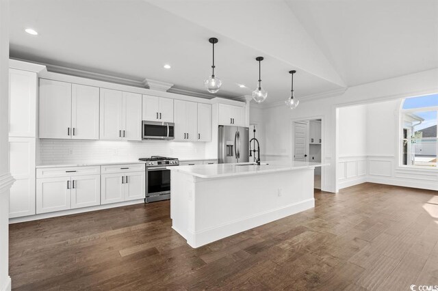 163 Sago Palm Dr, Myrtle Beach, SC 29579 - kitchen featuring appliances with stainless steel finishes, light countertops, backsplash, a kitchen island with sink, and white cabinetry