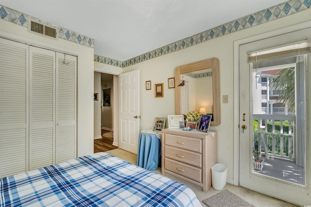 4601 Greenbriar Dr Unit 201, Little River, SC 29566 - bedroom with light colored carpet, multiple windows, visible vents, and a closet