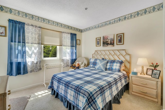 4601 Greenbriar Dr Unit 201, Little River, SC 29566 - bedroom with baseboards, a textured ceiling, and light colored carpet