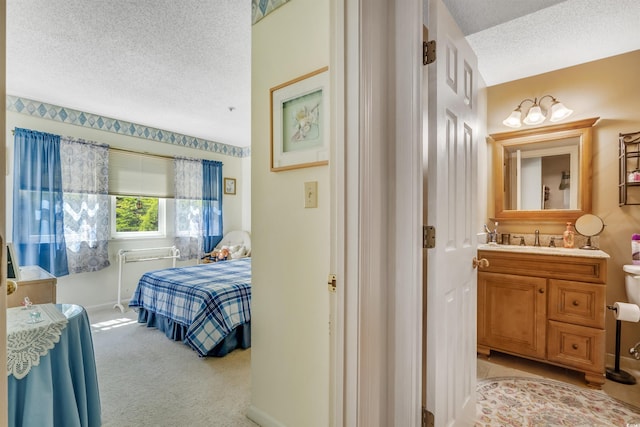 4601 Greenbriar Dr Unit 201, Little River, SC 29566 - interior space featuring baseboards, vanity, and a textured ceiling