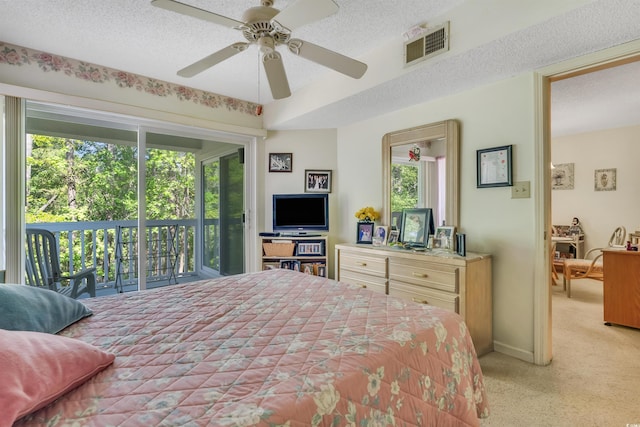 4601 Greenbriar Dr Unit 201, Little River, SC 29566 - bedroom featuring access to exterior, a ceiling fan, visible vents, a textured ceiling, and light colored carpet