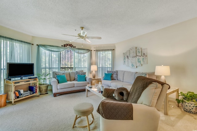 4601 Greenbriar Dr Unit 201, Little River, SC 29566 - carpeted living area featuring a textured ceiling and ceiling fan