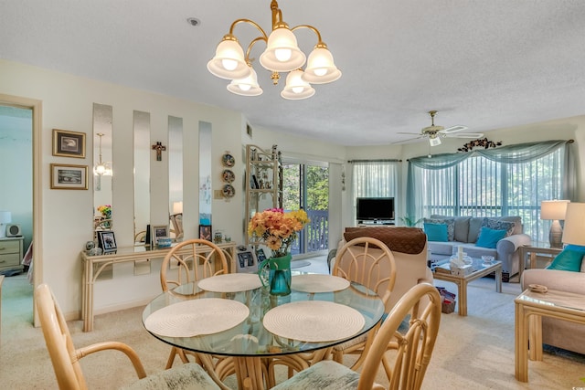 4601 Greenbriar Dr Unit 201, Little River, SC 29566 - dining area with visible vents, a textured ceiling, light colored carpet, and ceiling fan with notable chandelier