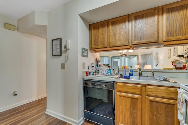 4601 Greenbriar Dr Unit 201, Little River, SC 29566 - kitchen with light countertops, a sink, baseboards, wood finished floors, and dishwasher