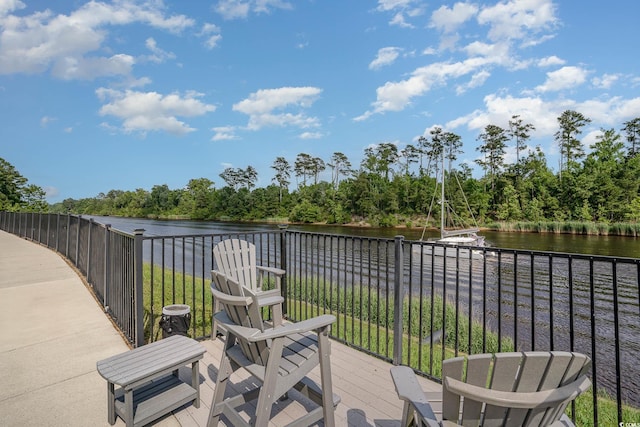 619 Waterway Village Blvd Unit 7C, Myrtle Beach, SC 29579 - view of patio featuring a water view and a wooded view