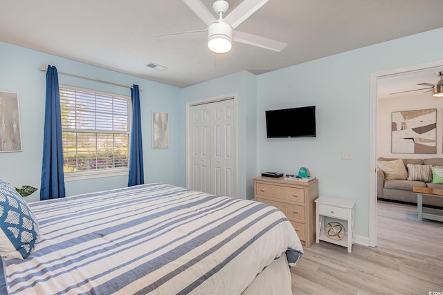 619 Waterway Village Blvd Unit 7C, Myrtle Beach, SC 29579 - bedroom with visible vents, a closet, light wood-style floors, baseboards, and ceiling fan