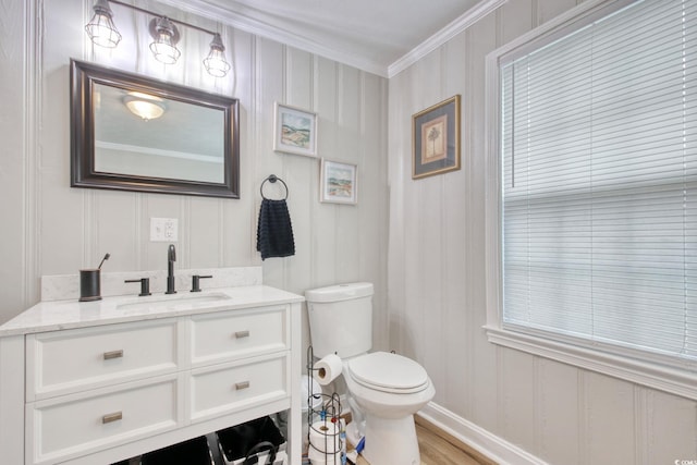 1028 1st Ave S, North Myrtle Beach, SC 29582 - bathroom featuring wood finished floors, vanity, ornamental molding, and toilet