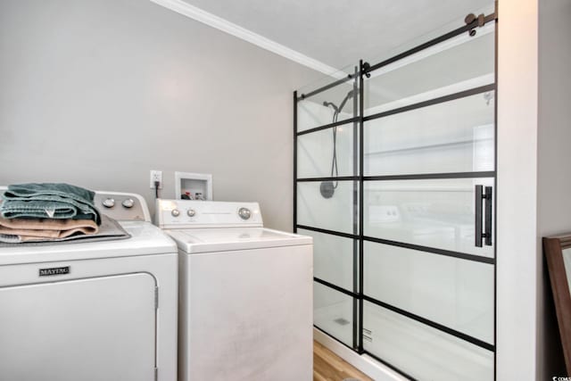 1028 1st Ave S, North Myrtle Beach, SC 29582 - clothes washing area featuring light wood-type flooring, crown molding, laundry area, and independent washer and dryer