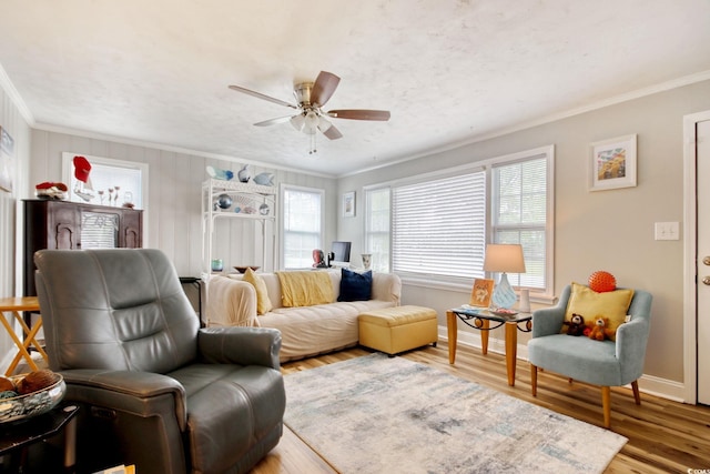 1028 1st Ave S, North Myrtle Beach, SC 29582 - living area with wood finished floors, crown molding, baseboards, and ceiling fan