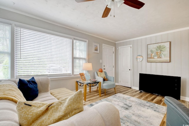 1028 1st Ave S, North Myrtle Beach, SC 29582 - living room featuring baseboards, wood finished floors, ceiling fan, and crown molding