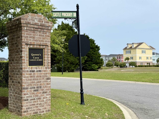 136 Queens Cove Pl Unit B, Myrtle Beach, SC 29579 - community / neighborhood sign with a lawn