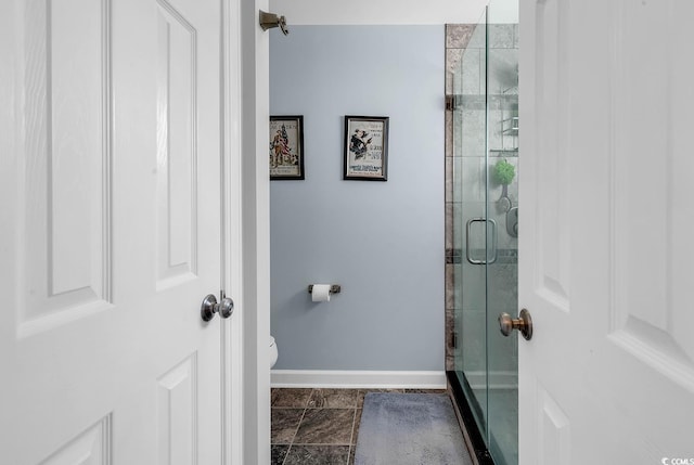 4755 Lightkeepers Way Unit 15-E, Little River, SC 29566 - bathroom featuring baseboards, a stall shower, and toilet