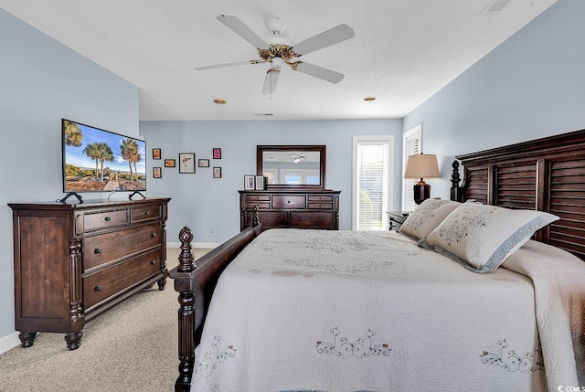 4755 Lightkeepers Way Unit 15-E, Little River, SC 29566 - bedroom with a ceiling fan, baseboards, visible vents, and light carpet
