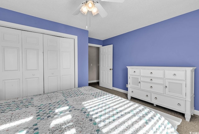 4755 Lightkeepers Way Unit 15-E, Little River, SC 29566 - bedroom with baseboards, a ceiling fan, dark carpet, and a closet