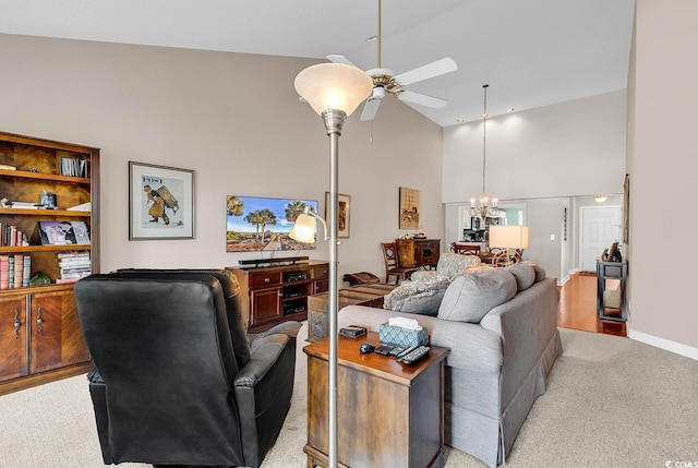 4755 Lightkeepers Way Unit 15-E, Little River, SC 29566 - living area with high vaulted ceiling, baseboards, ceiling fan with notable chandelier, and light colored carpet