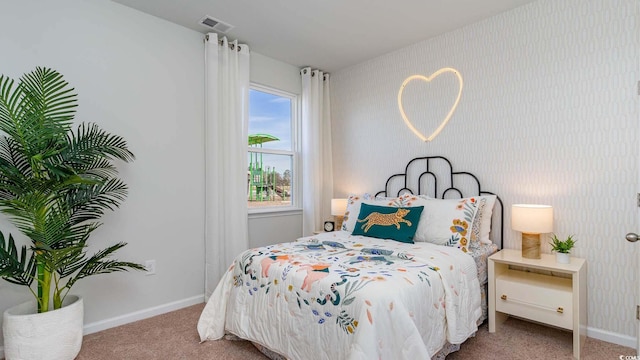 bedroom featuring carpet, baseboards, and wallpapered walls