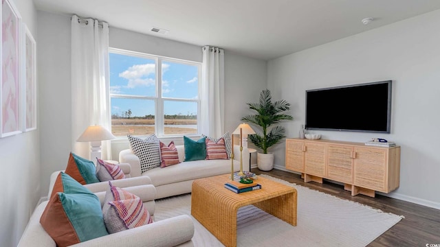 living room with wood finished floors and baseboards