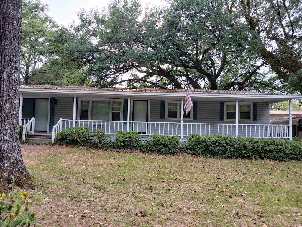 721 French Collins Rd, Conway, SC 29526 - view of front facade with covered porch and a front lawn