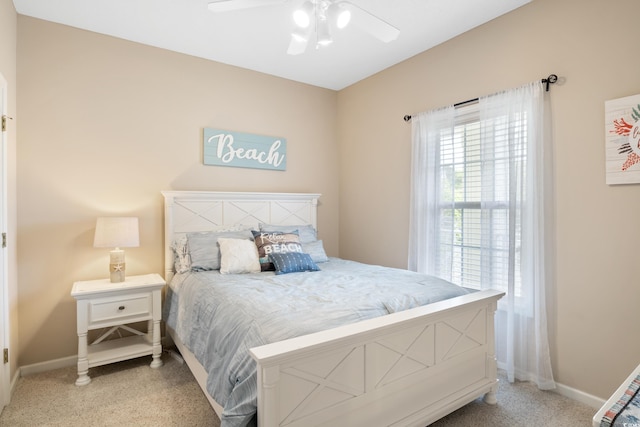 bedroom with baseboards, carpet, and ceiling fan