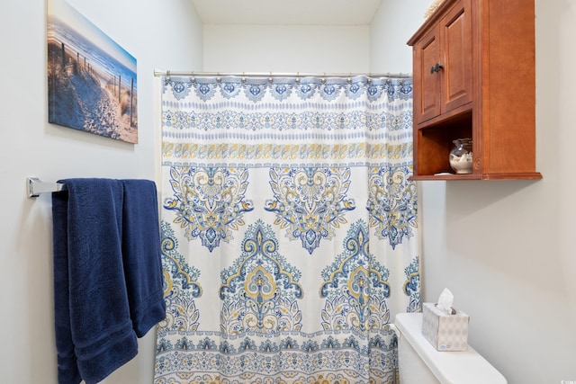 bathroom with a shower with curtain