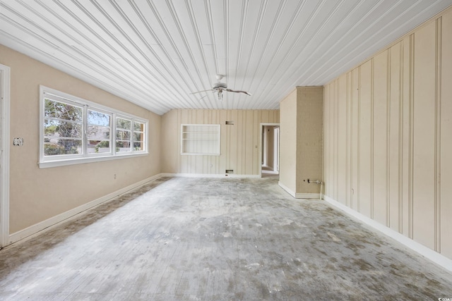 unfurnished living room featuring a ceiling fan and baseboards