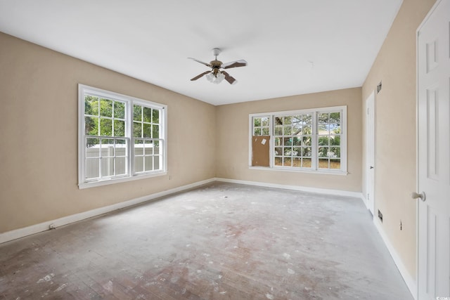 unfurnished room featuring baseboards and a ceiling fan