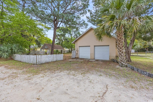 detached garage with fence