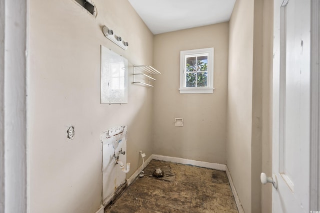 laundry room featuring baseboards