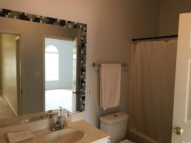 full bath featuring toilet and vanity